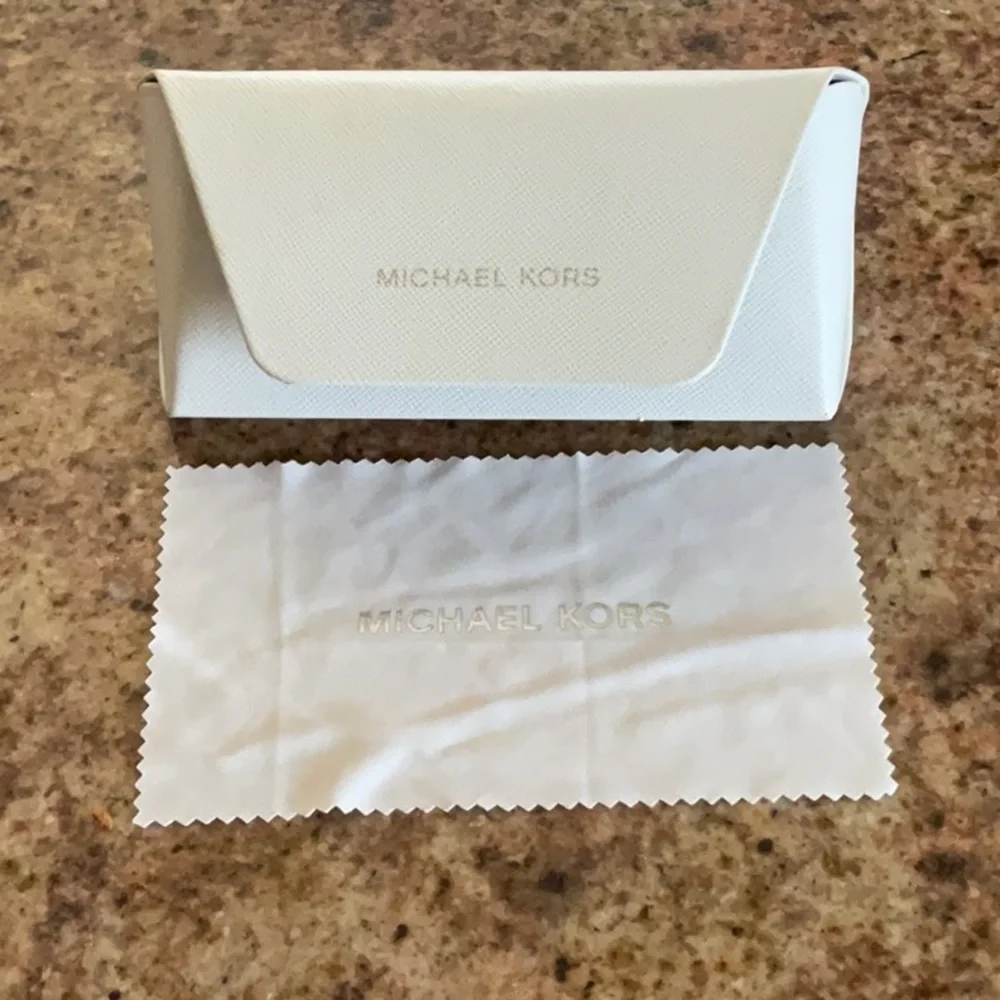 Michael Kors hard shell white eyewear case holder with cleaning cloth.